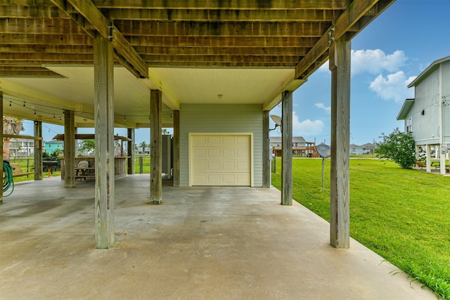 view of patio / terrace with a garage and a carport