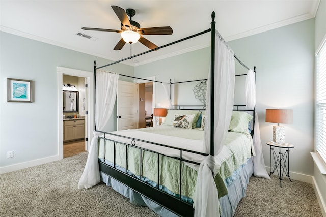 carpeted bedroom featuring ceiling fan, connected bathroom, and ornamental molding