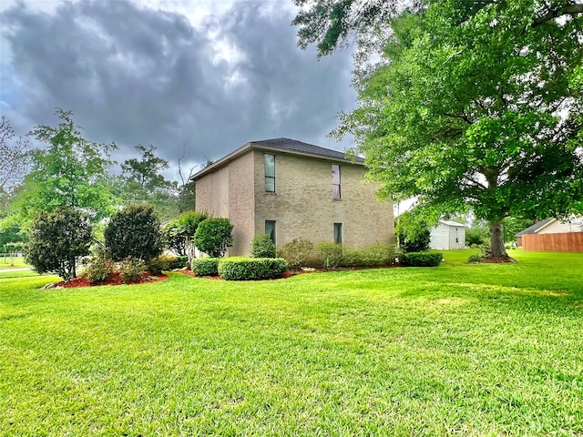 view of property exterior with a lawn