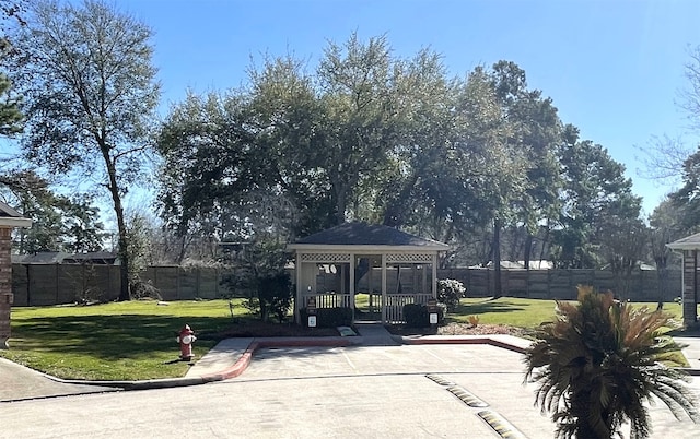 view of home's community with a gazebo and a lawn