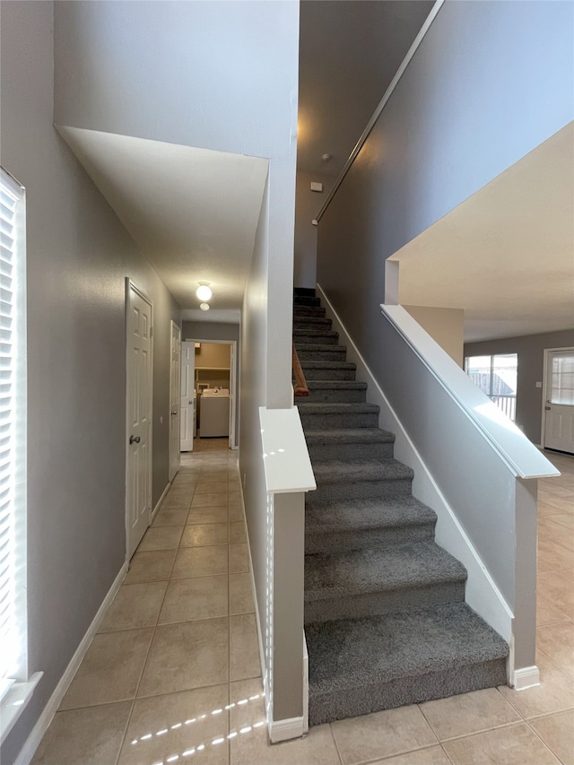 stairs featuring light tile flooring