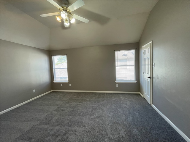 carpeted empty room featuring vaulted ceiling and ceiling fan