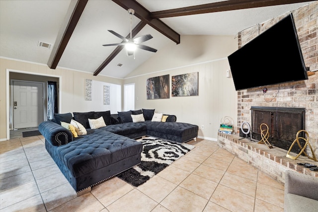 living room with light tile floors, ceiling fan, vaulted ceiling with beams, and a fireplace