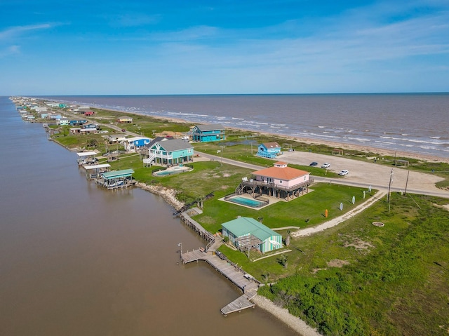 aerial view featuring a water view and a view of the beach