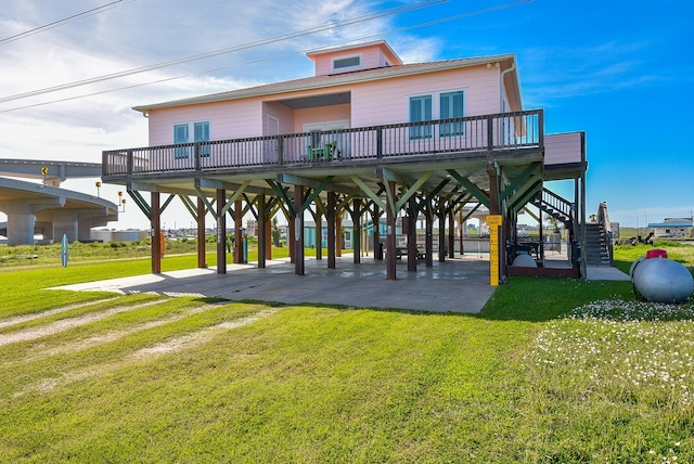 view of community with a carport and a yard