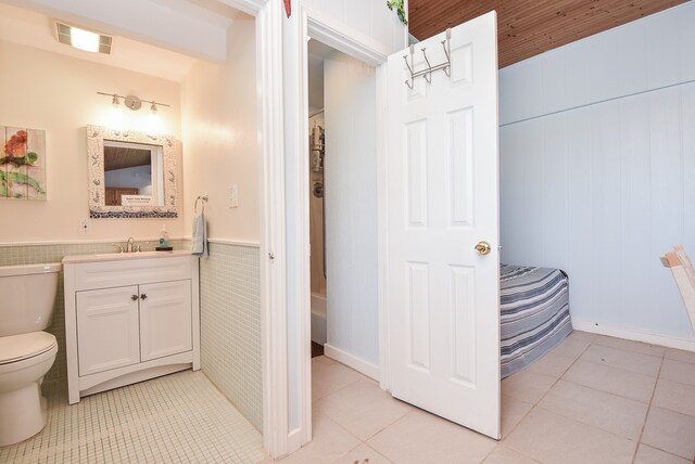 bathroom featuring wood ceiling, large vanity, toilet, and tile flooring