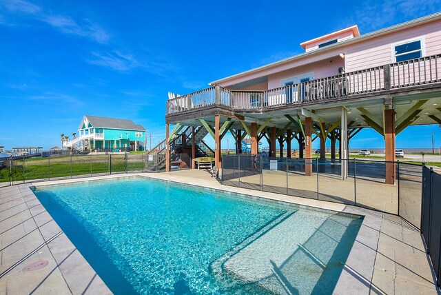 view of swimming pool featuring a patio