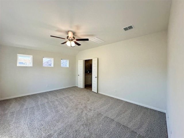 unfurnished room featuring carpet, ceiling fan, and lofted ceiling