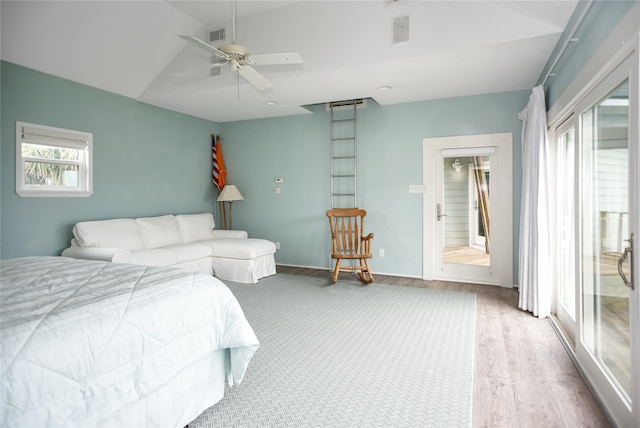 bedroom featuring vaulted ceiling, light hardwood / wood-style floors, and ceiling fan