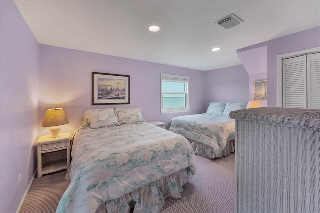 carpeted bedroom with a closet