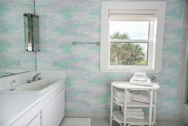 bathroom featuring vanity and tile floors