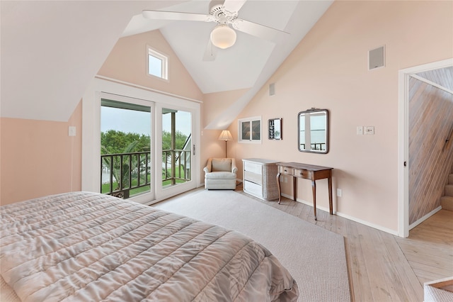 bedroom featuring ceiling fan, high vaulted ceiling, light hardwood / wood-style floors, and access to outside