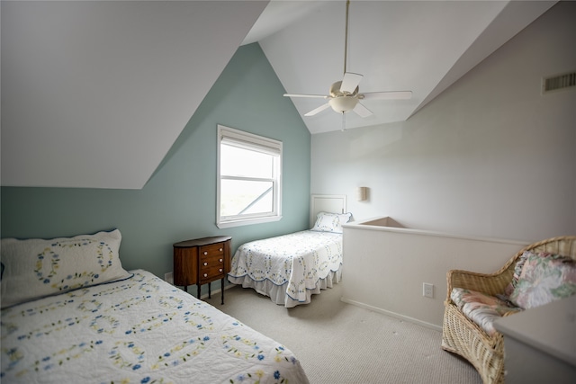 bedroom with light colored carpet, ceiling fan, and lofted ceiling