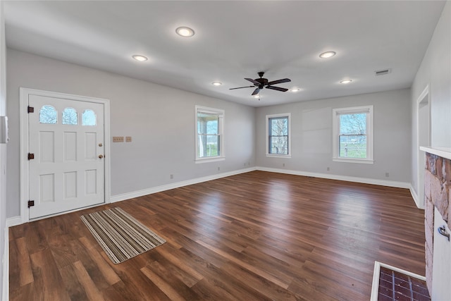 foyer featuring dark hardwood / wood-style flooring and ceiling fan