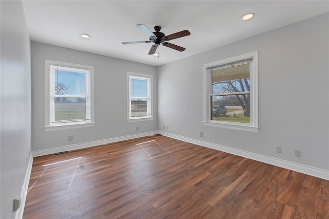 unfurnished room featuring dark hardwood / wood-style flooring and ceiling fan