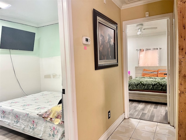 bedroom featuring hardwood / wood-style floors and ornamental molding