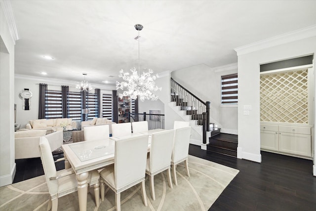 dining area featuring ornamental molding, dark wood-type flooring, and a chandelier