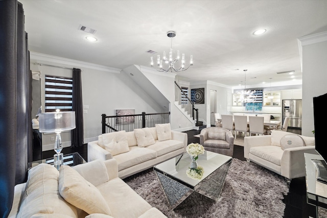 living room featuring ornamental molding, a healthy amount of sunlight, and a chandelier