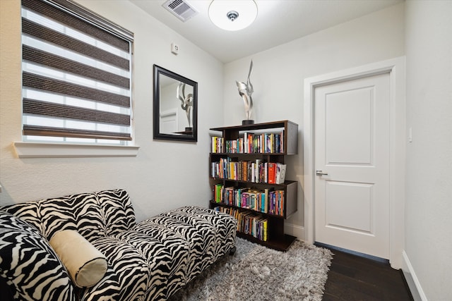 sitting room featuring dark wood-type flooring