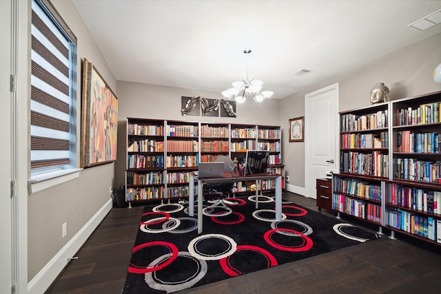 interior space with dark hardwood / wood-style flooring and a chandelier