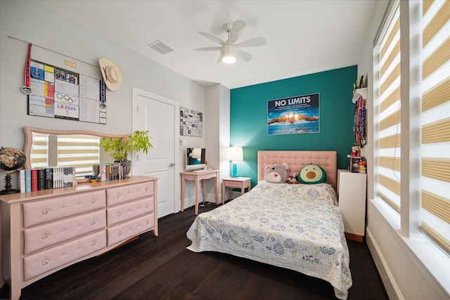 bedroom with ceiling fan and dark hardwood / wood-style flooring