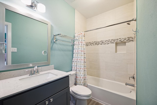 full bathroom with shower / tub combo with curtain, vanity, and toilet