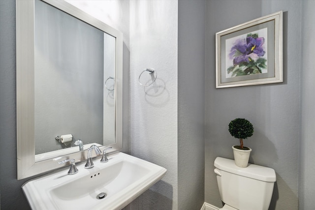 bathroom with sink and toilet