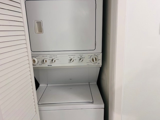 laundry area with stacked washing maching and dryer