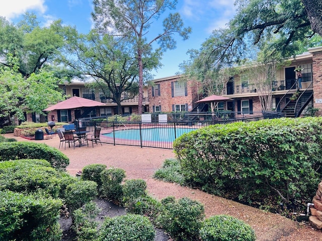 view of swimming pool with a patio