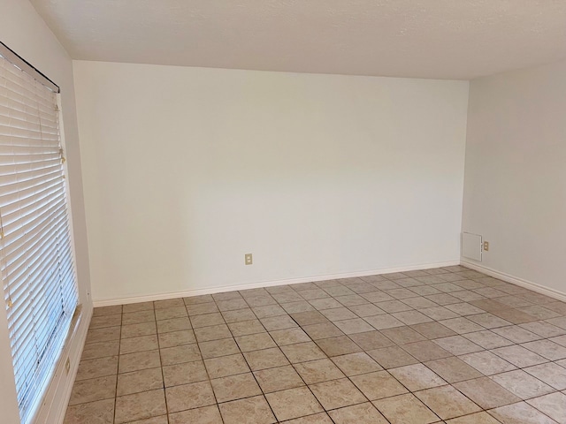 view of tiled spare room