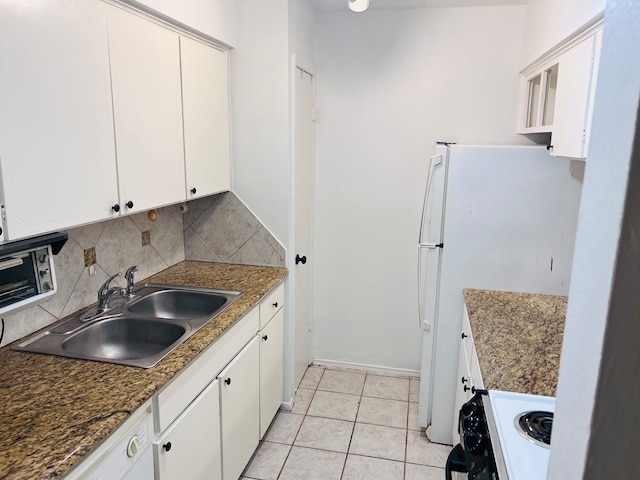 kitchen with white cabinets, backsplash, sink, and light tile flooring