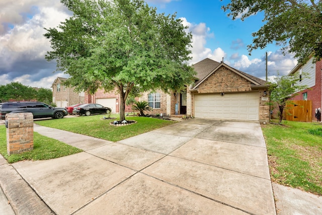 view of front of property featuring a front lawn and a garage