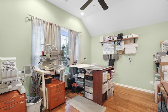 office space featuring vaulted ceiling, ceiling fan, and light wood-type flooring