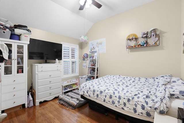 bedroom with lofted ceiling, ceiling fan, and dark hardwood / wood-style floors