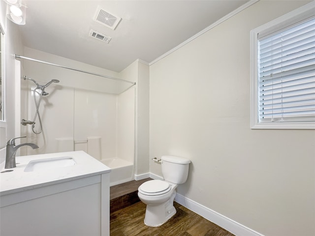 bathroom featuring hardwood / wood-style flooring, toilet, and vanity