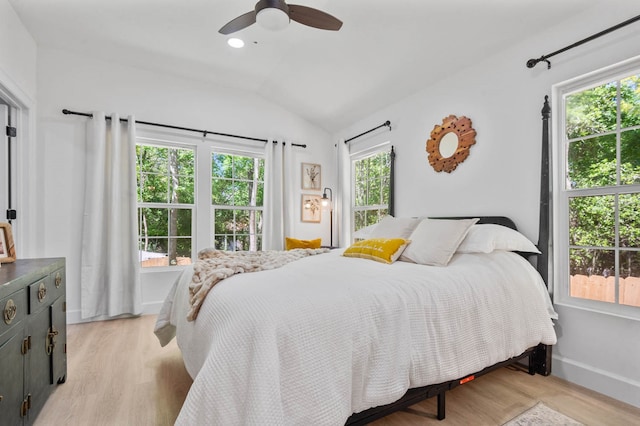 bedroom featuring vaulted ceiling, ceiling fan, and light hardwood / wood-style flooring