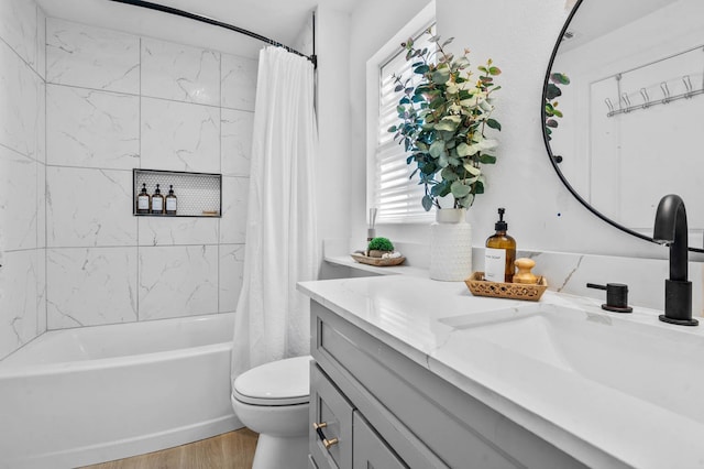 full bathroom featuring shower / tub combo, toilet, vanity, and wood-type flooring