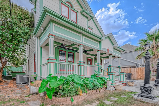 view of front of property featuring cooling unit, covered porch, and ceiling fan