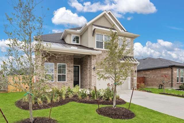 view of front of property featuring a front yard and a garage