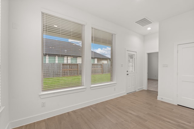 unfurnished room featuring light wood-type flooring