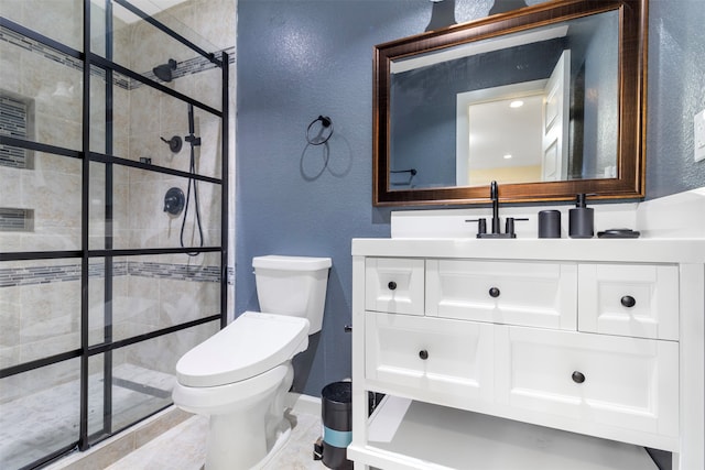 bathroom with tile patterned flooring, vanity, walk in shower, and toilet