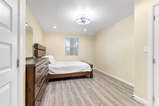 bedroom featuring light hardwood / wood-style floors