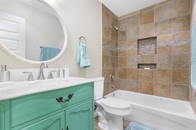 full bathroom with tiled shower / bath combo, tile patterned flooring, toilet, and vanity