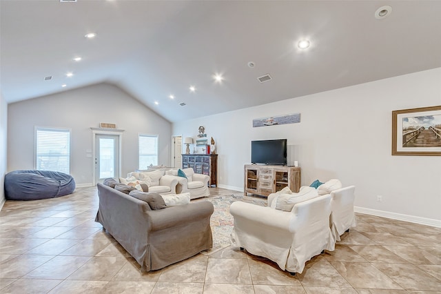 tiled living room with high vaulted ceiling