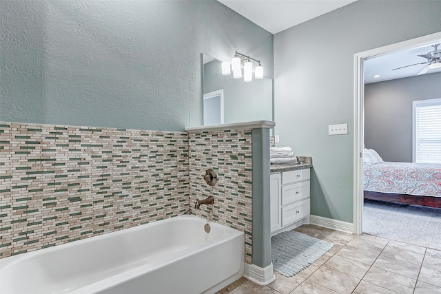 bathroom with ceiling fan, tile floors, and vanity