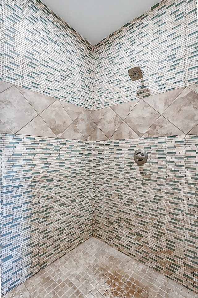 bathroom with tiled shower