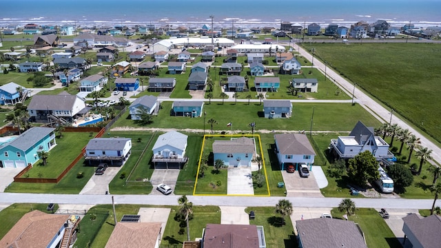 aerial view featuring a residential view and a water view