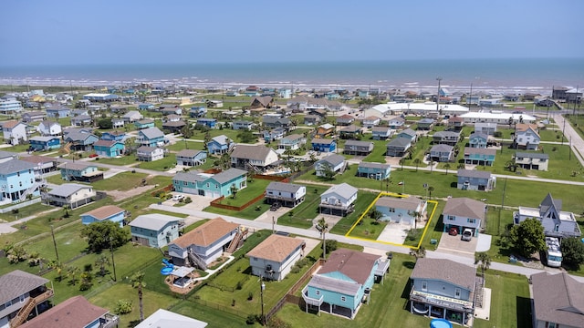 bird's eye view with a residential view and a water view