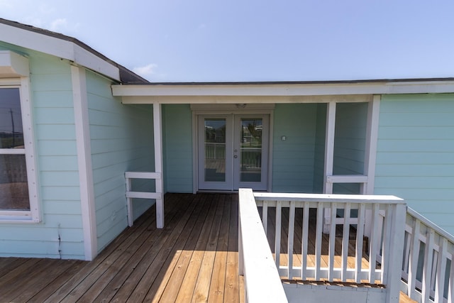 wooden deck featuring french doors