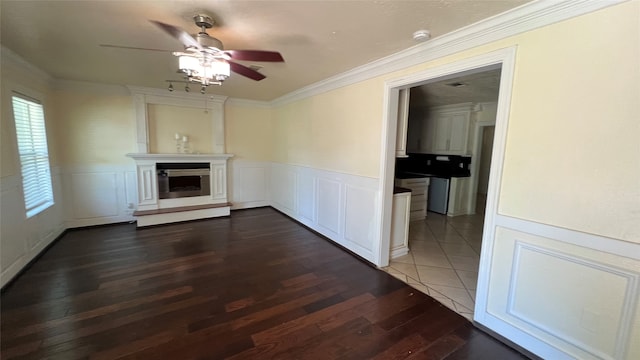 interior space with ceiling fan, tile floors, and crown molding